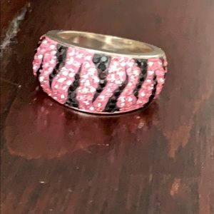 Pink and black jeweled ring.